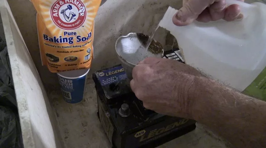 Pour Baking Soda And Water Mixture Over The Batteries